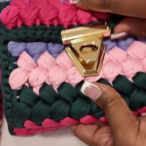 Multicoloured woven purse with gold hardware